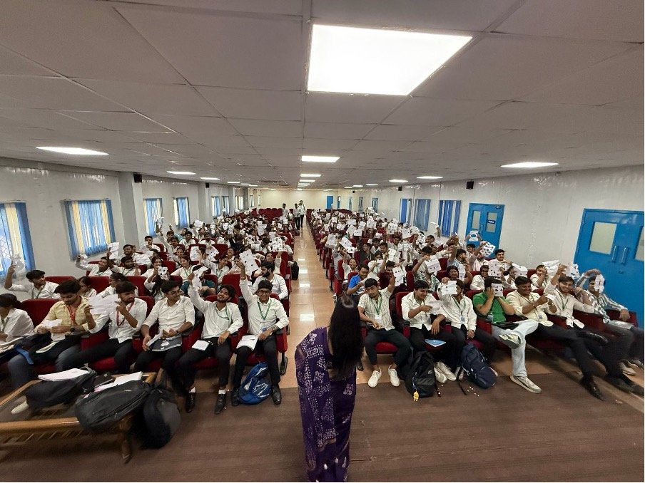Voyage Ahead facilitator leading an interactive educational program with a large student audience
